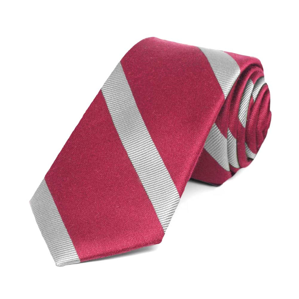Ruby red and silver striped skinny tie, rolled to show the texture of the stripes