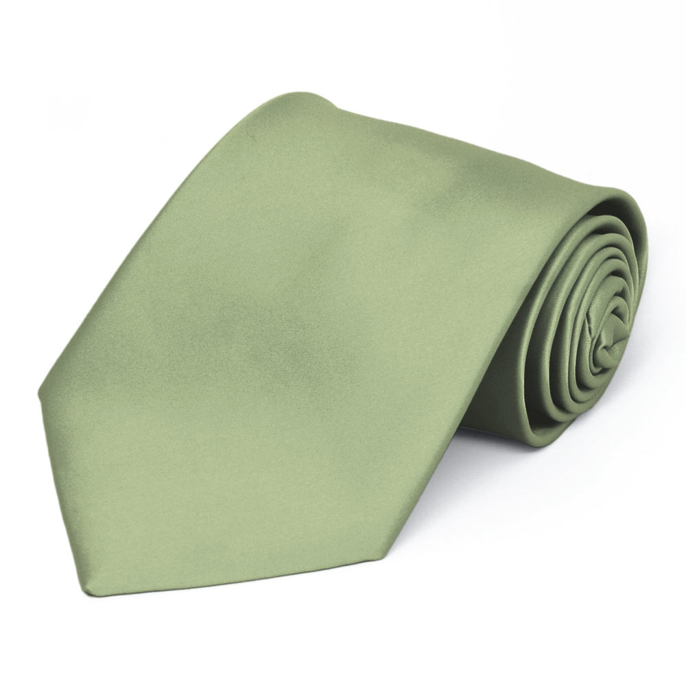 A sage tie in an extra long length, rolled to show off the front of the tie