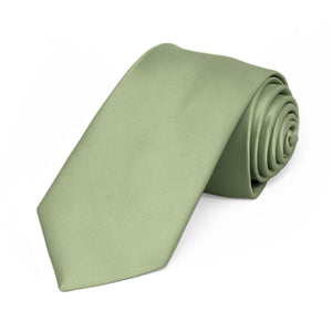 A sage solid slim tie, rolled to show off the tip of the tie