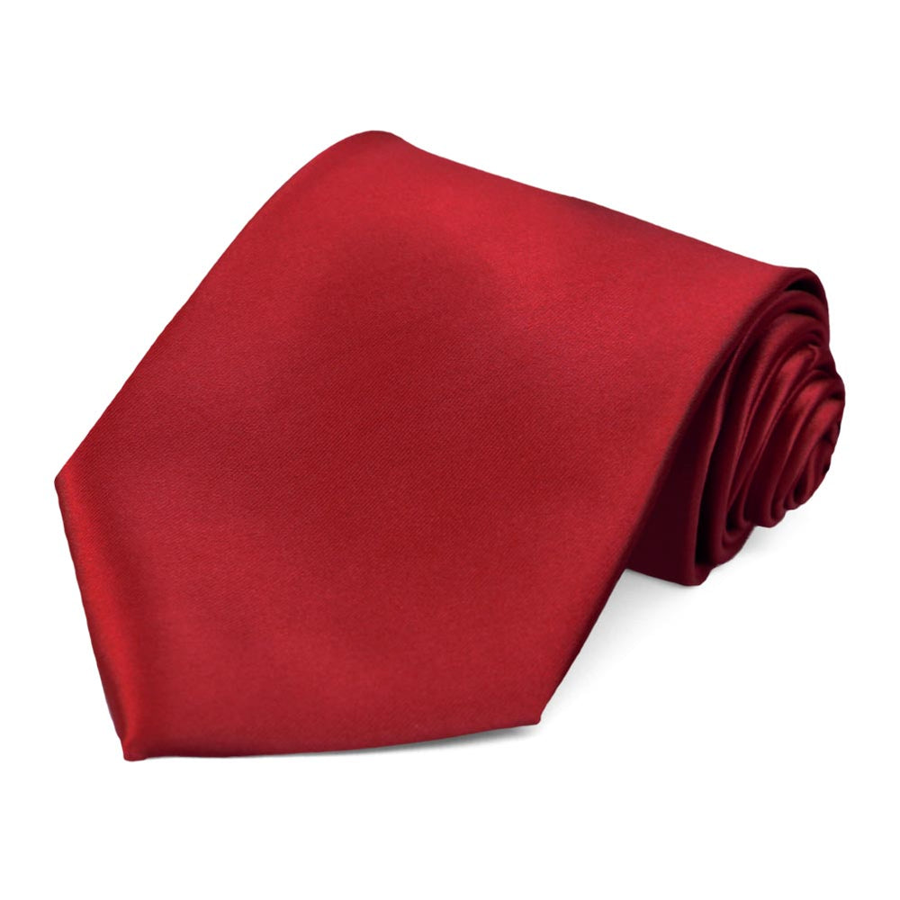 A scaret red necktie with a satin sheen.