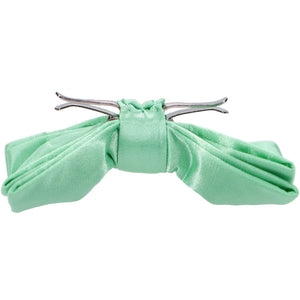 The side view of a seafoam solid color clip-on bow tie