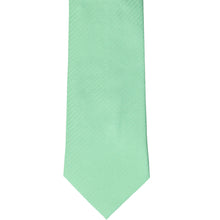 Load image into Gallery viewer, The front of a seafoam herringbone tie, laid out flat