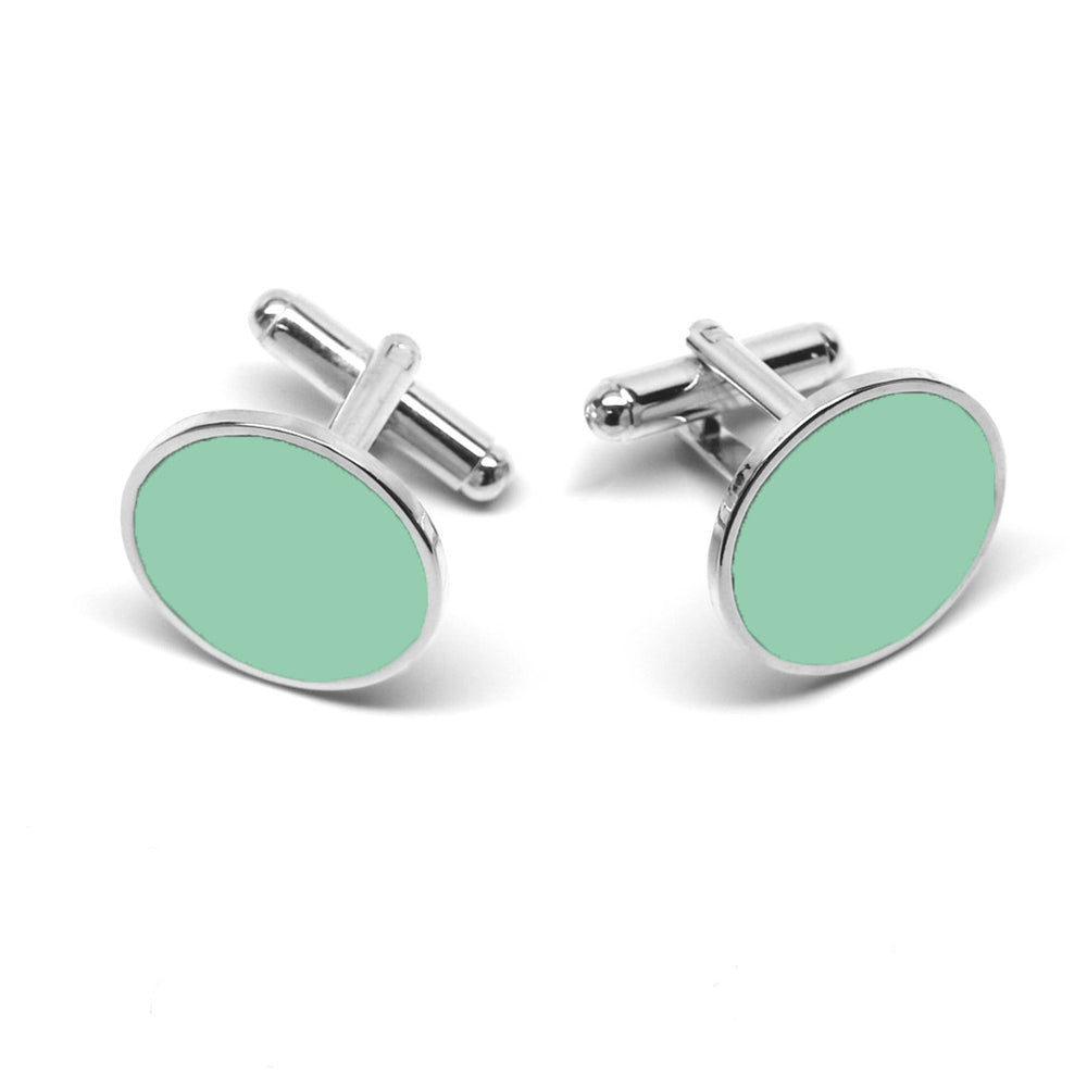 Silver background cufflinks with a round seafoam face.