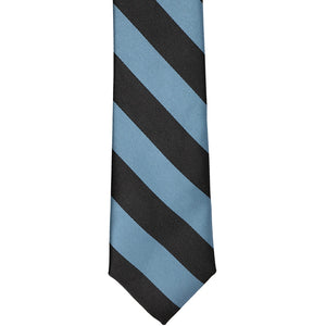 The front of a serene and black striped tie, laid out flat