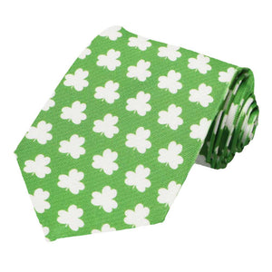 A green and white shamrock tie, rolled to show off the pattern
