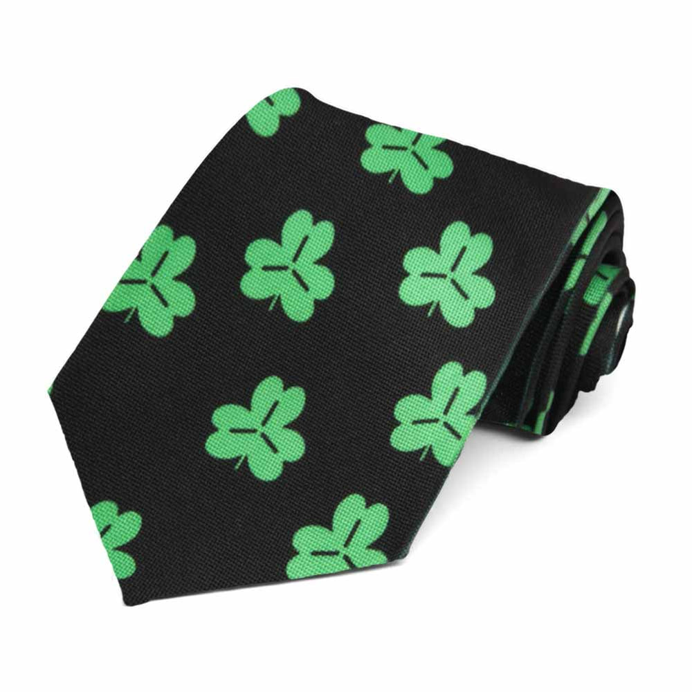 Green shamrocks on a black tie