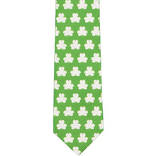 Load image into Gallery viewer, The front of a green and white shamrock tie, laid out front