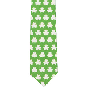The front of a green and white shamrock tie, laid out front