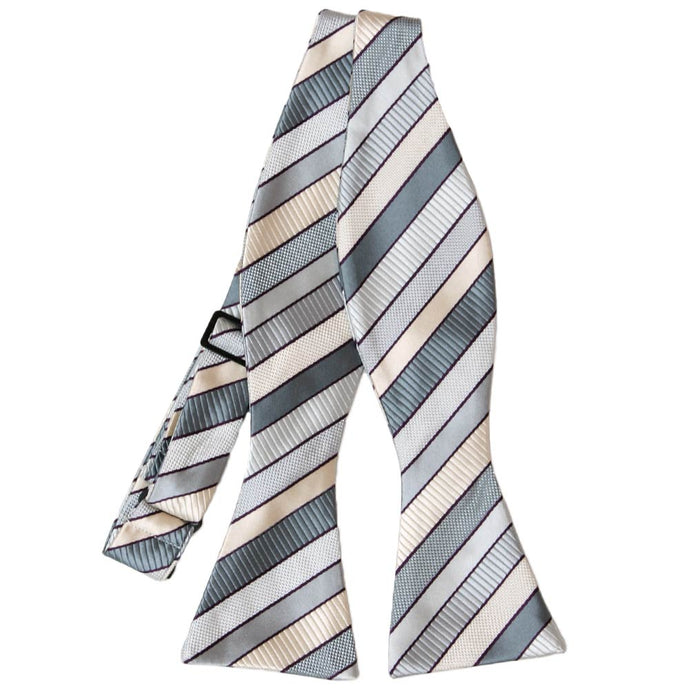 Flat front view of an untied light silver and cream striped self-tie bow tie