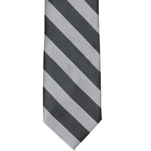 Load image into Gallery viewer, The front of a silver and dark gray striped tie, laid out flat
