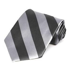 Rolled view of a silver and dark gray tie