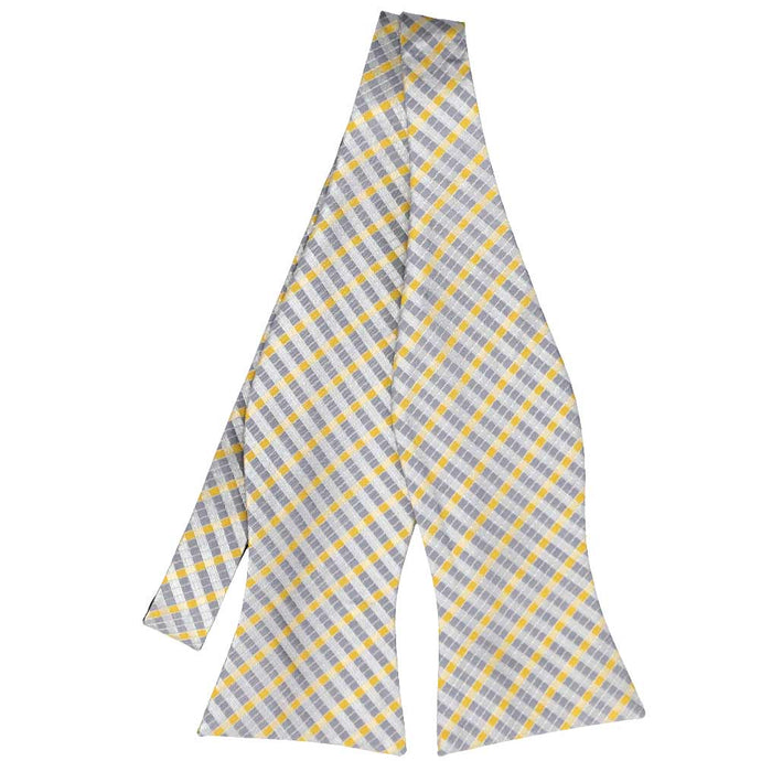 Untied view of a silver and yellow plaid self-tie bow tie