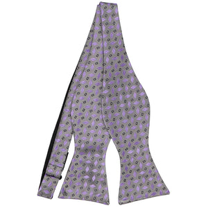 An untied silver self-tie bow tie with a lavender geometric pattern