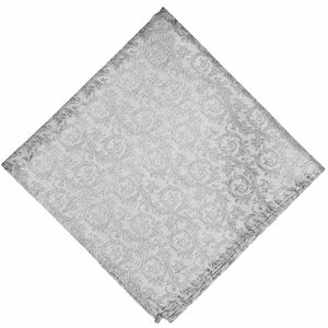 A folded light silver tone on tone floral pocket square