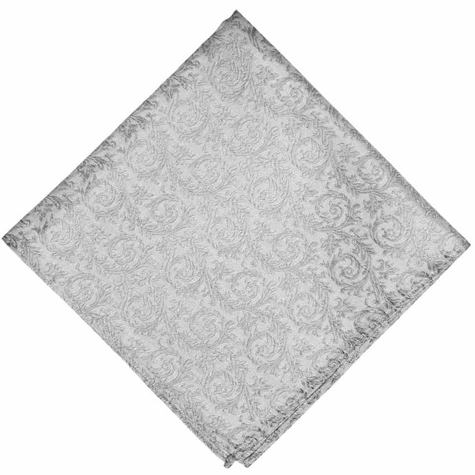 A folded light silver tone on tone floral pocket square