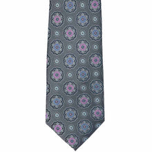 Load image into Gallery viewer, The front of a silver tie with floral medallions