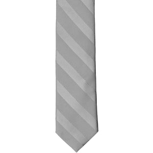 The front of a silver skinny striped tie, laid out flat