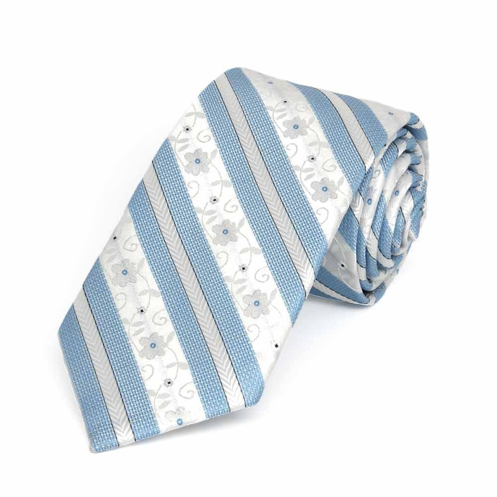 Rolled view of a blue and white floral stripe slim necktie