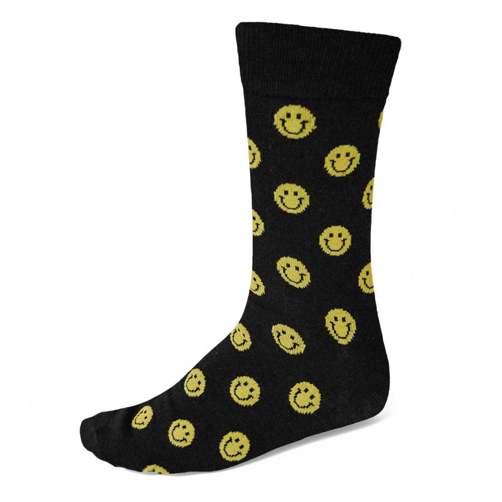 Men's yellow smiley face theme socks on black background