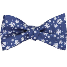 Load image into Gallery viewer, A tied self-tie bow tie with a white and blue snowflake pattern