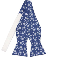 Load image into Gallery viewer, An untied self-tie bow tie with a blue and white snowflake pattern