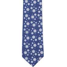 Load image into Gallery viewer, The front of a dark blue tie with scattered snow flakes