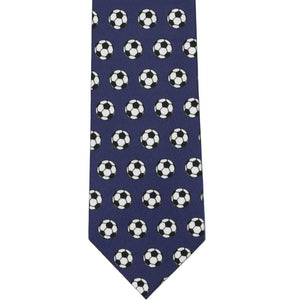 The front of a navy blue tie with an all over soccer ball pattern