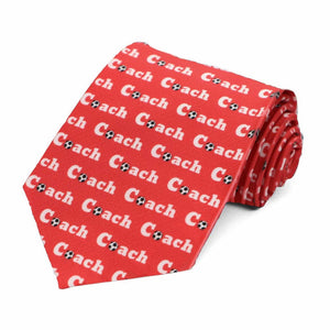 A red soccer coach tie, with an all over coach word pattern
