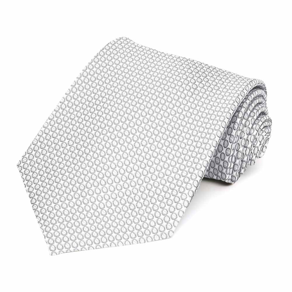 Rolled view of a light gray circle pattern necktie