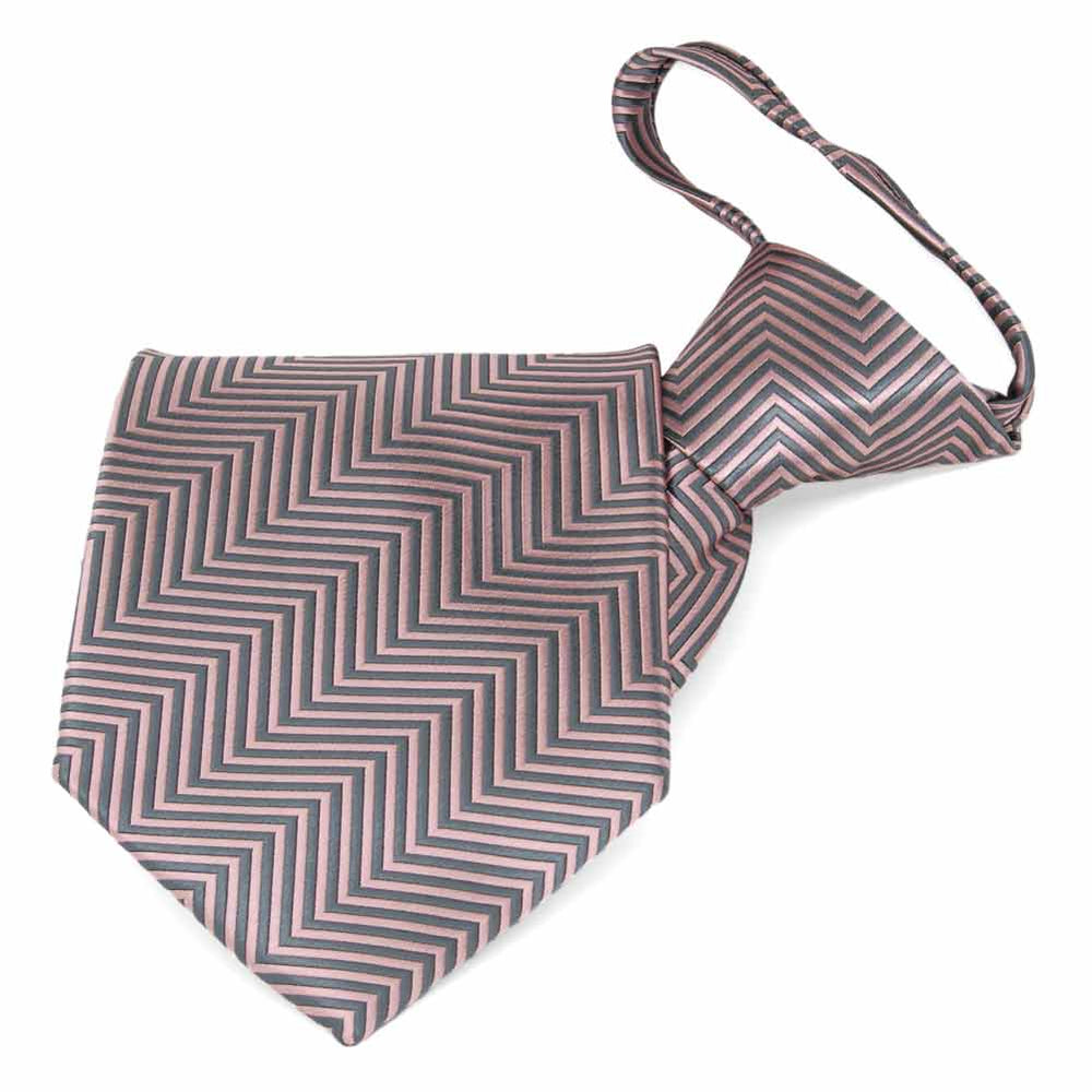 Folded view of a pink and gray chevron pattern zipper style tie