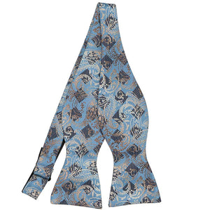 An untied paisley and checked self-tie bow tie in muted blues and tans