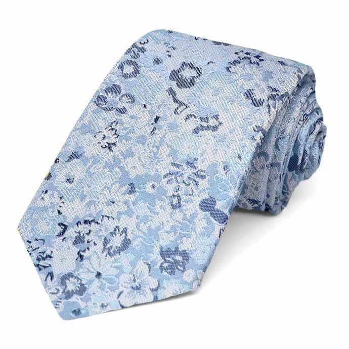 Steel blue floral tie, rolled to show off pattern and texture