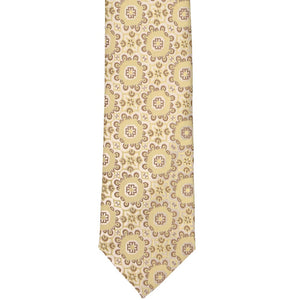The front tip of a straw colored abstract floral slim tie