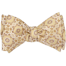 Load image into Gallery viewer, A tied self-tie bow tie in a straw abstract floral pattern