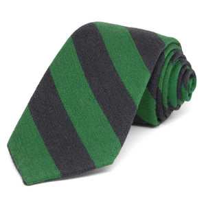 Gray and green wide striped wool tie, rolled to show texture