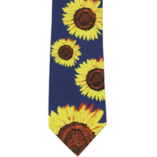Load image into Gallery viewer, Flat dark blue necktie with scattered sunflowers on it