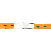 Load image into Gallery viewer, T-Rex green dinosaur on a golden yellow bow tie clip on edges.