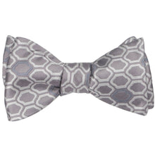 Load image into Gallery viewer, A tied self-tie bow tie in a taupe geometric pattern