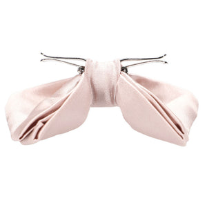 Side view of a tea rose pink clip-on bow tie