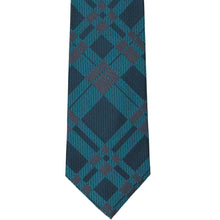 Load image into Gallery viewer, A dark teal and navy blue plaid necktie laid flat