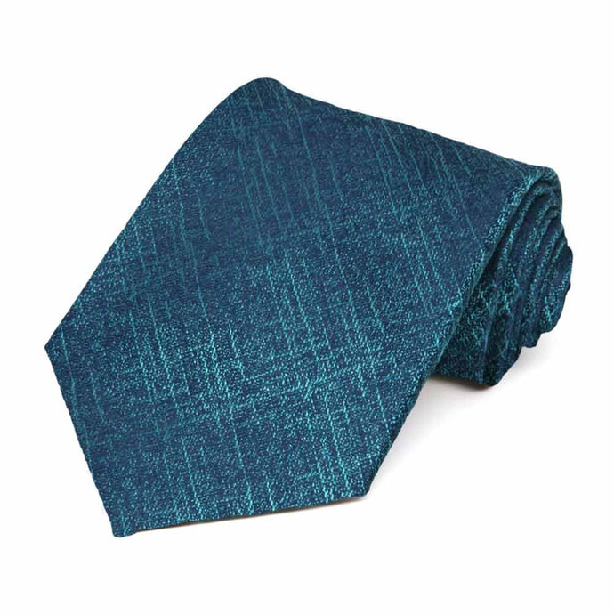 Teal blue crosshatch textured silk tie, rolled to show pattern
