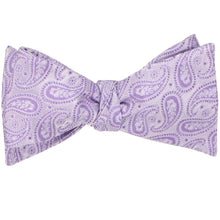 Load image into Gallery viewer, A tied self-tie bow tie in a light purple paisley pattern