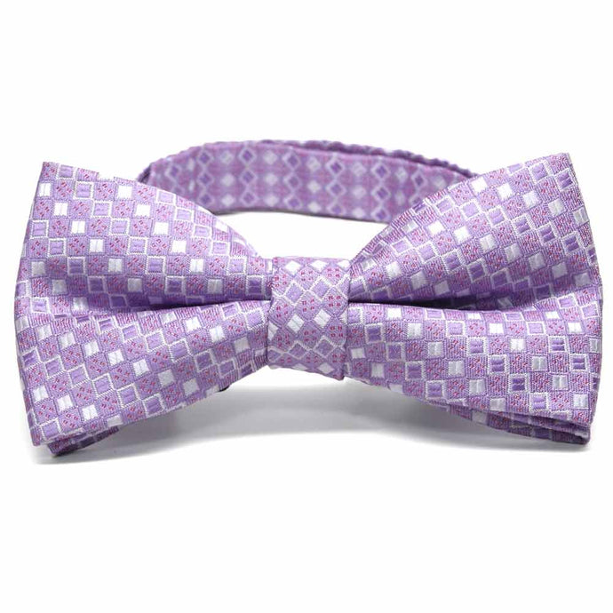 Close up view of a light purple square pattern bow tie
