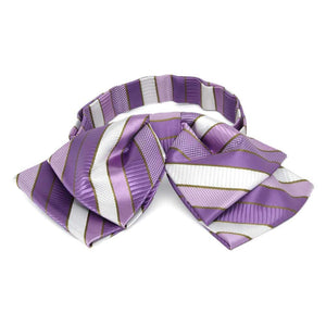 Front view of a purple, white and gold striped floppy bow tie