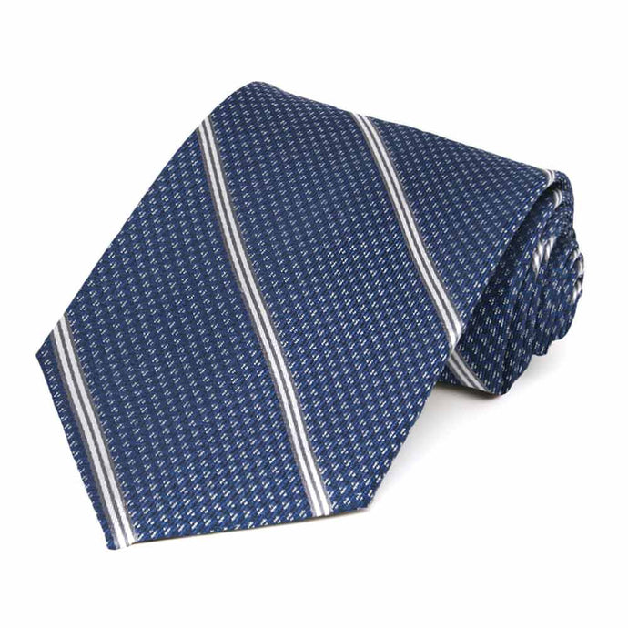 A rolled blue necktie featuring thin white stripes and a small white geometric pattern