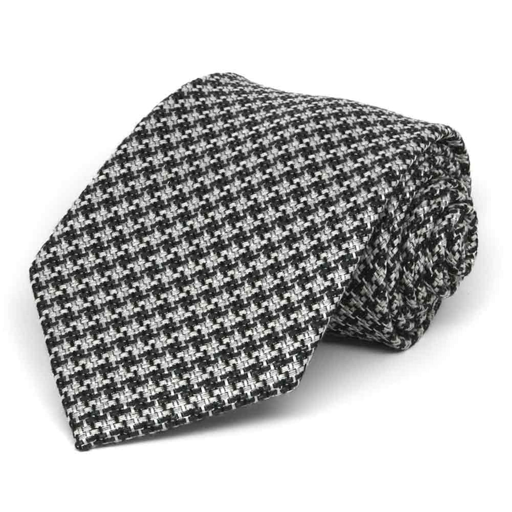 Black and white tweed extra long tie, rolled to show the rugged texture
