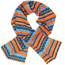 Load image into Gallery viewer, A women&#39;s scarf in a blue and orange ugly sweater pattern with reindeer and snowflakes, crossed over itself