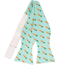 Load image into Gallery viewer, An untied self-tie bow tie with a carrot pattern on an aqua background