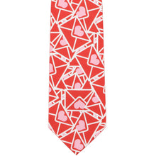 Load image into Gallery viewer, The front of a red novelty tie with a scattered Valentine envelope design