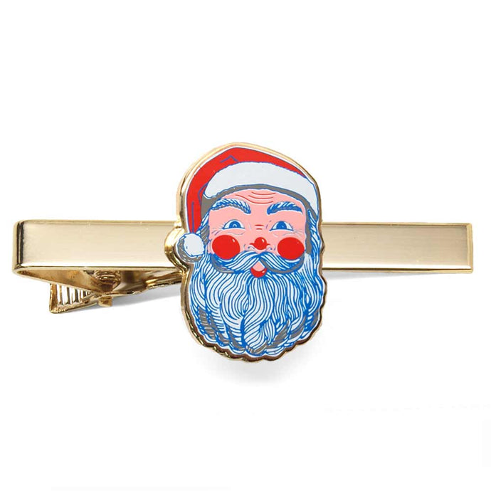 Santa face theme tie bar on a gold background.